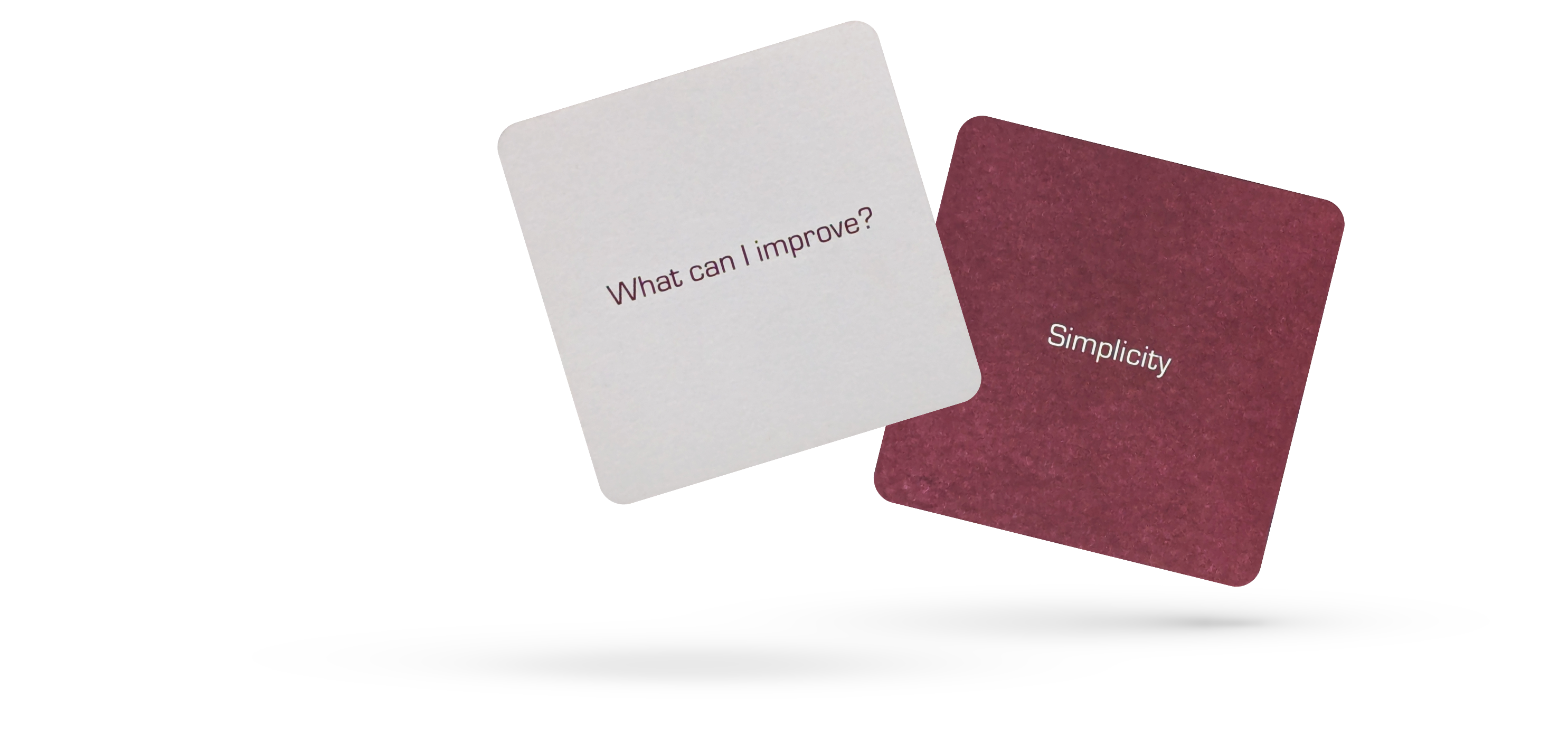 Two hovering mindfulness cards, one white card with 'What can I improve?' and one red card with 'Creativity'.